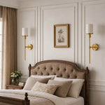 Załaduj obraz do przeglądarki galerii, Natural brass wall sconces in a bedroom
