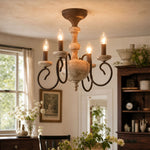 Carica l'immagine nella visualizzazione Galleria, warm lit dining room scene with four light chandelier