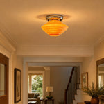 Load image into Gallery viewer, vintage amber glass ceiling light in a warm hallway scene