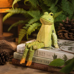 Carica l'immagine nella visualizzazione Galleria, Hand-carved wooden frog ornament styled on a tabletop edge