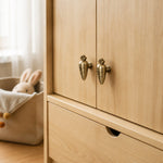 Afbeelding laden in galerijweergave, Rabbit and carrot cabinet knobs on a wooden wardrobe