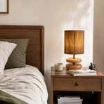 Cargar imagen en el visor de la Galería, Wood table lamp with hemp rope shade on a bedside table
