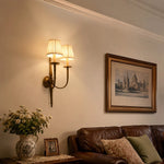 Load image into Gallery viewer, Antique brass wall sconce in a classic living room