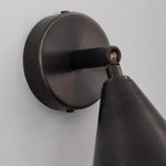 Cargar imagen en el visor de la Galería, Round wall plate and adjustable arm detail on matte black wall light