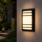 Załaduj obraz do przeglądarki galerii, Outdoor wall light installed on an exterior wall at night