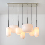 Load image into Gallery viewer, Lumivelle Sculptural 7-Light Chandelier – Adjustable Height Modern Glass Pendant