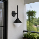 Cargar imagen en el visor de la Galería, black and white waterproof wall sconce beside an outdoor patio railing
