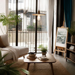 Cargar imagen en el visor de la Galería, Wood pendant light above a small living room table beside a window