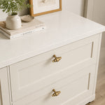 Afbeelding laden in galerijweergave, Antique brass handles installed on white drawers