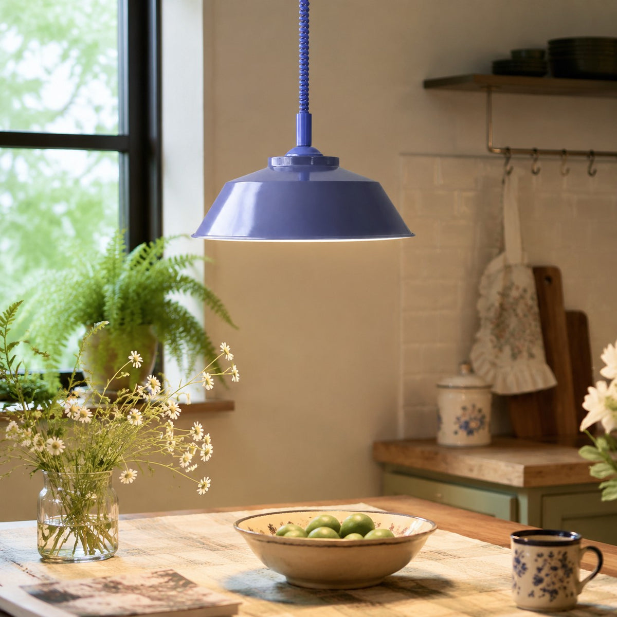 Memphis pull-down pendant in a dining space