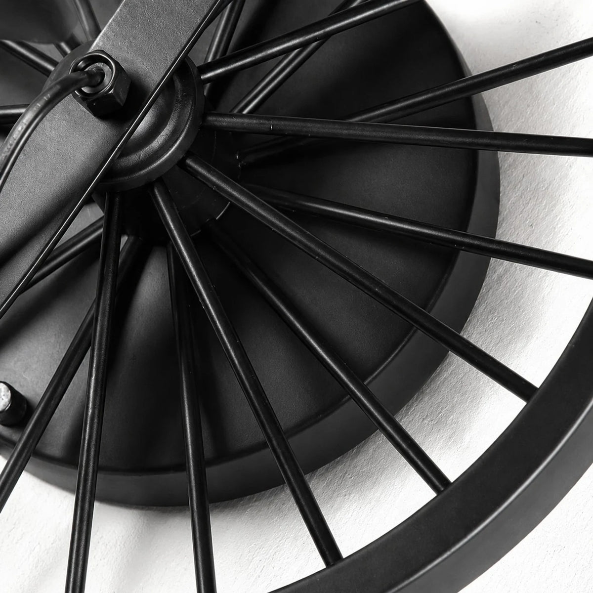 Close view of the black wagon wheel backplate and spoke detail