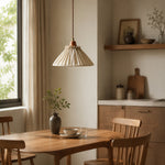 Load image into Gallery viewer, Natural linen pendant light glowing above a round dining table