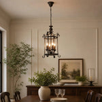 Afbeelding laden in galerijweergave, Black iron pendant installed in a bright dining room