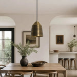 Afbeelding laden in galerijweergave, Brass pendant lamp installed above a dining space