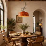 Cargar imagen en el visor de la Galería, Orange metal and ceramic pendant lamp above a rustic dining table