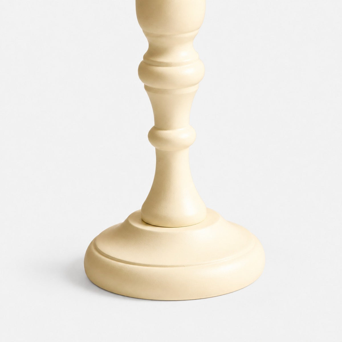 Close view of the carved wood base