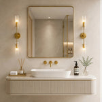 Carica l'immagine nella visualizzazione Galleria, Copper two-head alabaster wall sconces warming a modern vanity