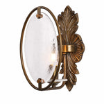 Cargar imagen en el visor de la Galería, Side view of antique brass wall sconce with oval textured glass shade