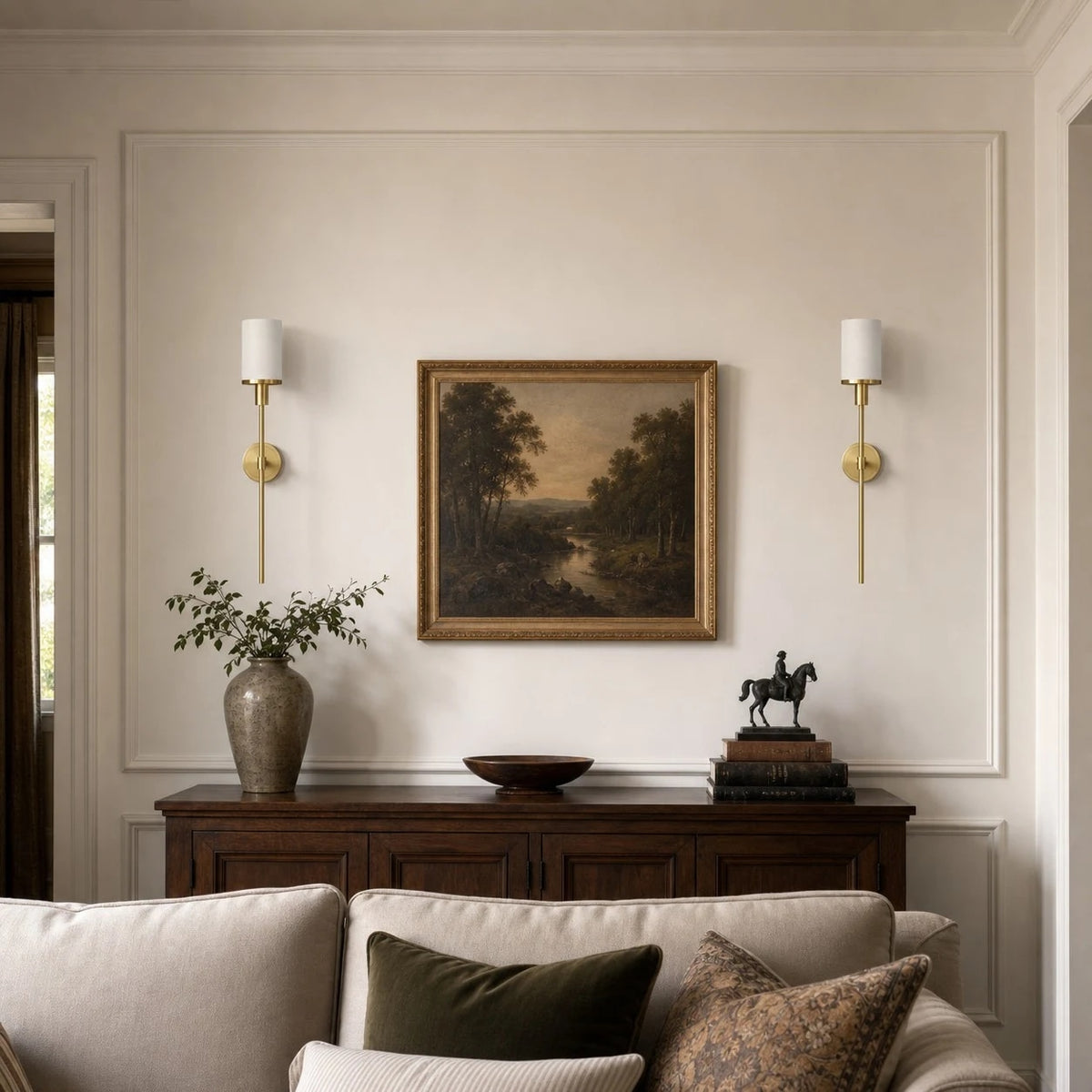 Natural brass wall sconces beside a sofa