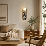 Bild in die Galerieansicht laden, Decorative fabric wall sconce in a soft lounge setting