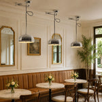 Cargar imagen en el visor de la Galería, Chrome pendant lights installed in a French cafe dining room