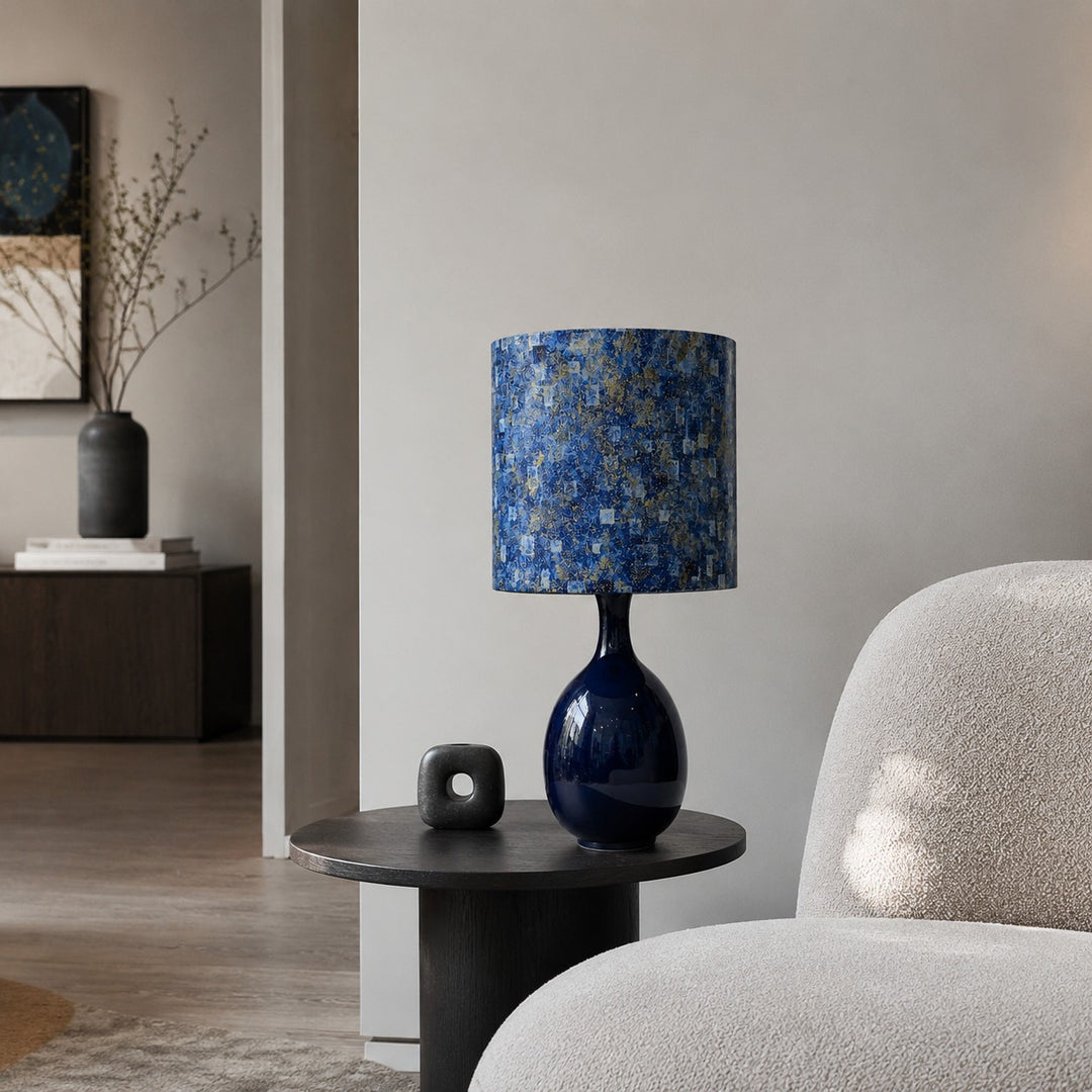 Blue gold fabric ceramic table lamp on a side table