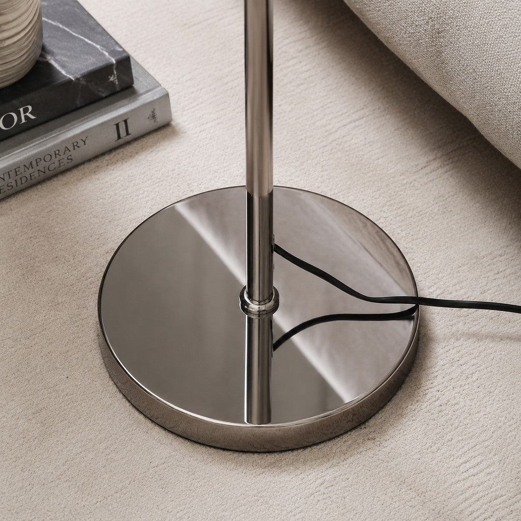 Polished chrome floor lamp base and stem detail