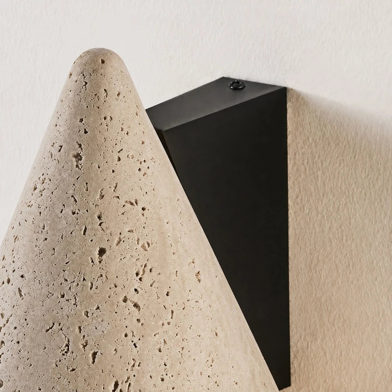 Black wall plate and travertine cone side detail