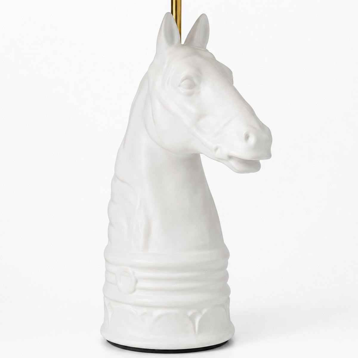 Close detail of white horse head table lamp base