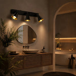 Załaduj obraz do przeglądarki galerii, Black adjustable cone wall light in a warm bathroom scene