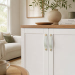 Afbeelding laden in galerijweergave, Cowhide leather and brass cabinet pull handle detail and lifestyle image