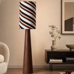 Cargar imagen en el visor de la Galería, Tall striped shade floor lamp beside a console table