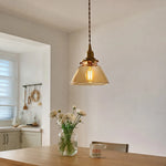 Cargar imagen en el visor de la Galería, Amber glass pendant above a small table