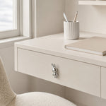 Afbeelding laden in galerijweergave, Chrome silver rabbit knob on a white desk drawer