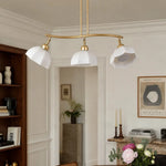 Załaduj obraz do przeglądarki galerii, Three-light chandelier installed above a dining area