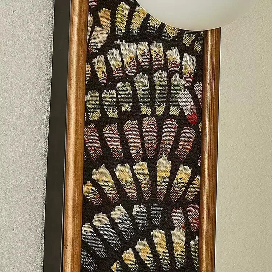 Close detail of fabric panel and warm metal edge