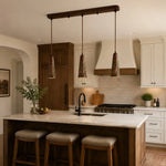 Cargar imagen en el visor de la Galería, Three hammered copper pendant lights above a kitchen island