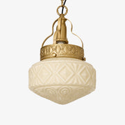 Beige embossed glass pendant light with brass hardware