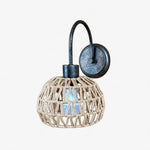 Cargar imagen en el visor de la Galería, Shade A woven rattan wall sconce in antique brass