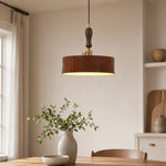 Load image into Gallery viewer, Vintage brown leather pendant installed over a quiet dining nook