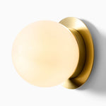 Load image into Gallery viewer, Rivolence Wall Sconce – Antique Brass Milk Glass Light
