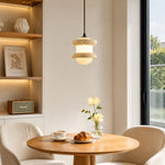 Cargar imagen en el visor de la Galería, Single travertine stone pendant light above a small round table