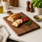 Cargar imagen en el visor de la Galería, Black walnut cutting board used for bread and table serving