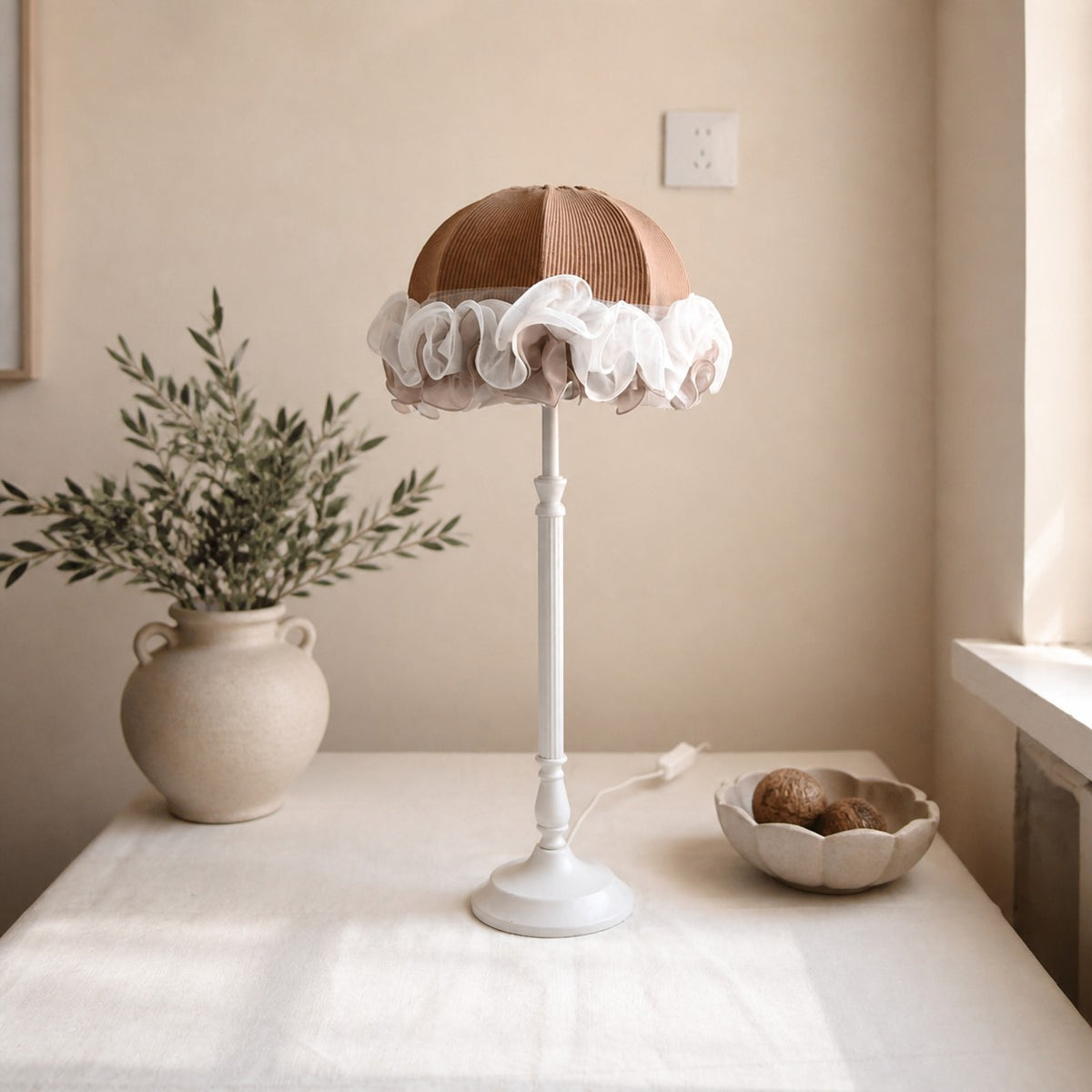 French vintage table lamp beside window with tabletop decor
