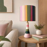 Charger l'image dans la visionneuse de la galerie, Colorful striped ceramic table lamp with cotton thread wrapped exterior in a cozy living room corner