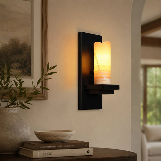 Rustic black metal wall sconce in a living room setting