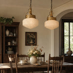 Afbeelding laden in galerijweergave, Pair of embossed glass pendant lights above a dining table