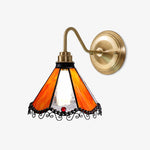 Cargar imagen en el visor de la Galería, Orange stained glass wall sconce with antique brass-tone arm