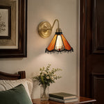 Cargar imagen en el visor de la Galería, Orange stained glass wall sconce beside a vanity mirror