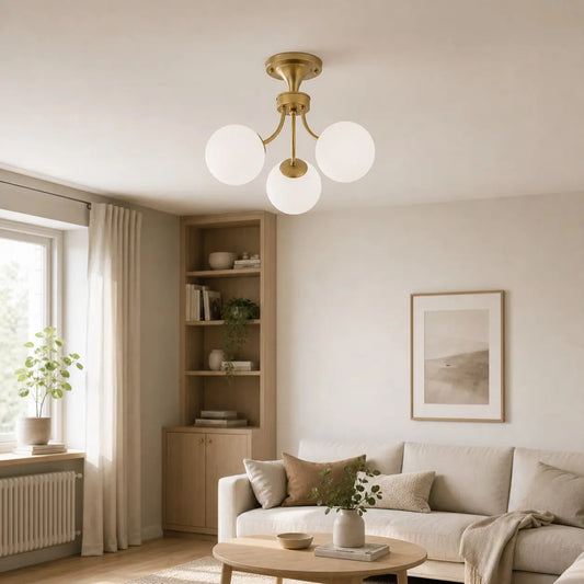 Gold globe ceiling light installed in a living room